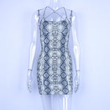 Hugcitar backless hollow out sexy bodycon dresses 2018 autumn women fashion club snakeskin print mini club dress